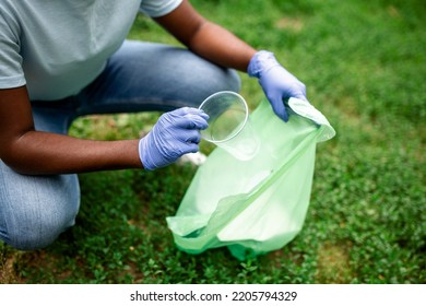 Group Of Volunteers Cleaning Up Forest From Waste, Community Service Concept