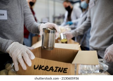 Group of volunteers collect donations for Ukrainian refugees, humanitarian aid concept. - Shutterstock ID 2130605936