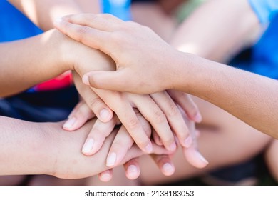 Group Of Volunteers Kids Children Hands Joining Hands Together, Unity Ready Fight.teamwork And Partner.Sport Day Student At School.Next Generation Co Operation.Friendship. Initiative Volunteer Team.