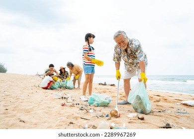 Group of Volunteers multi-Generation family picking up plastic trash and garbage together at the beach on summer holiday vacation. Environmental conservation earth day and waste pollution concept. - Powered by Shutterstock