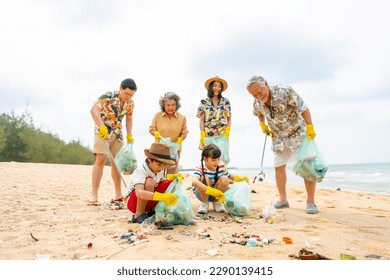 Group of Volunteers multi-Generation family picking up plastic trash and garbage together at the beach on summer holiday vacation. Environmental conservation earth day and waste pollution concept. - Powered by Shutterstock