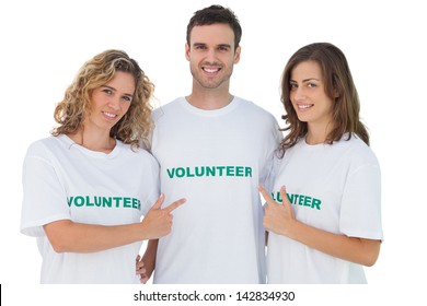 Group Of Volunteers Pointing Their Tshirt On White Background