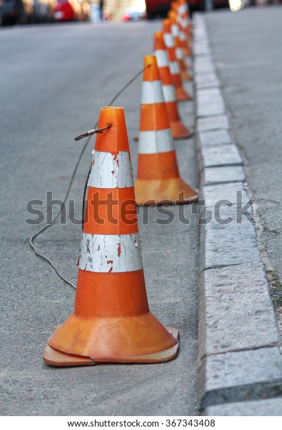 Group warning cones on\
the road. Objects