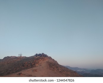 Group Watching Sunrise In Eilat Mountains