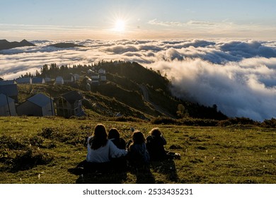 Group Watching Sunset Over Cloud-Covered Valley at Gomis Mta, Georgia