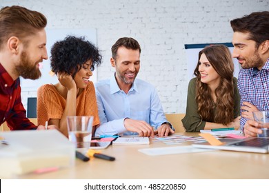 Group of web designers prototyping new web site design - Powered by Shutterstock