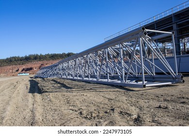 A group of welded triangular iron bars used on the roofs of buildings.