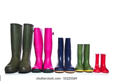 A group of wellie boots isolated on a white background.