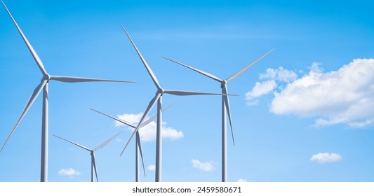 A group of wind turbines against blue sky, Wind energy. Wind power. Sustainable, renewable energy. Wind turbine generate electricity. Sustainable resources. Green technology for energy sustainability. - Powered by Shutterstock