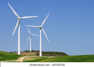 group of windmills for renewable electric energy production - Shutterstock ID 187370726