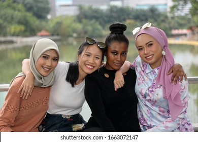 Group Of Woman Malay Chinese Indian Malaysian  Hug Friends Togetherness Unity Outdoor Green Park Lake Nature 