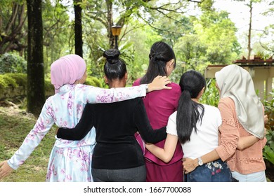 Group Of Woman Malay Chinese Indian Asian Outdoor Green Park Walk Hand On Shoulder Waist  Together Unity 
