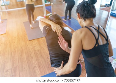 Group Women Asian Doing Stretching Yoga Hot Exercises With Instructor In Studio