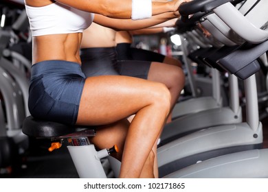 Group Of Women Cycling In Gym