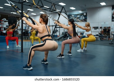 Group Of Women Doing Exercise In Gym, Back View