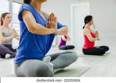 Group Of Women Doing Yoga Indoors