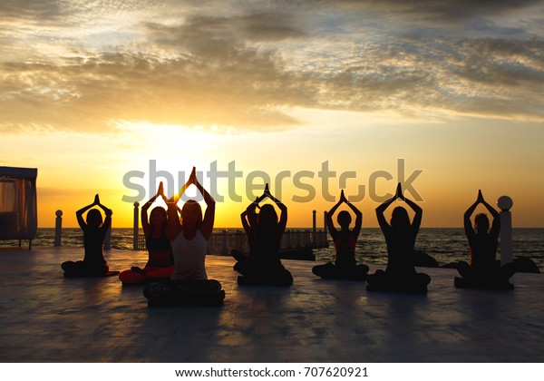 Group Women Doing Yoga Sunrise Near Stock Photo (Edit Now) 707620921
