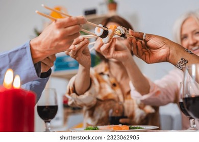 group women eating sushi, at home - Powered by Shutterstock