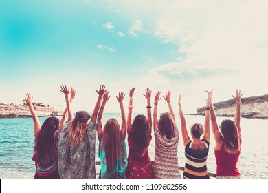 Group Of Women Enjoying And Celebrate Summer Vacation All Together Saying Hallo To The Ocean And The Nature. Young People Leisure Activity, All Hands Up And Vintage Colors Style. Fashion Dresses 