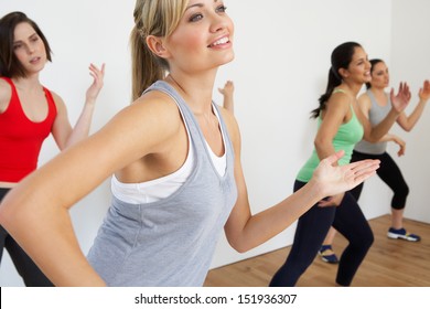 Group Of Women Exercising In Dance Studio