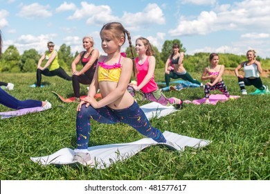 Group of women exercising and doing lunge at boot camp. - Powered by Shutterstock