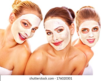 Group Women With  Facial Mask In Beauty Spa.