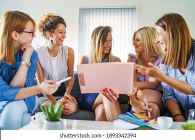 Group Of Women Female Only Colleagues Or Friends Working Together On Project Sitting On Sofa Bed In Room Or At Work - Millennial Entrepreneurs Having Meeting Brainstorming Female Empowerment Concept