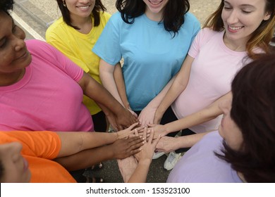 Group Of Women With Hands Together Showing Unity 