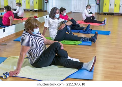 Group Of Women Retired Seniors Attending Gym Class. Wearing Protective Mask, Social Distancing, Concept Of Active Retirement, Fitness.