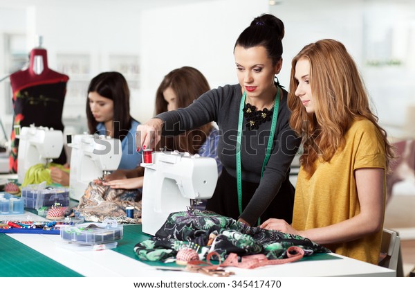 Group of women in a sewing\
workshop