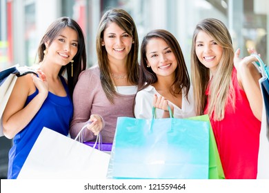 Group Of Women Shopping At The Mall Looking Happy