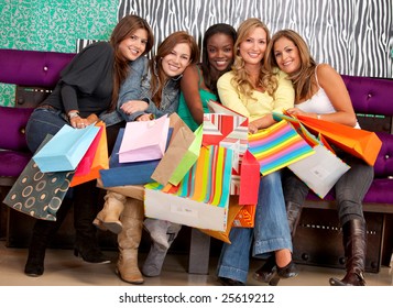 Group Of Women Shopping In A Mall With Some Bags