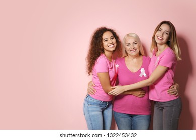 Group of women with silk ribbons and space for text on color background. Breast cancer awareness concept - Powered by Shutterstock