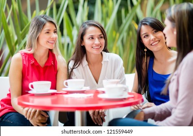 Group Of Women Talking Over A Cup Of Coffee