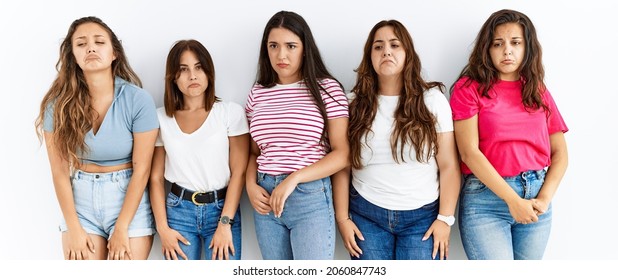 Group Of Women Wearing Casual Clothes Standing Over Isolated Background Depressed And Worry For Distress, Crying Angry And Afraid. Sad Expression. 