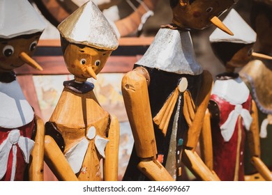 Group Of Wooden Pinocchio Marionette Under The Sunlight.
Selective Focus.