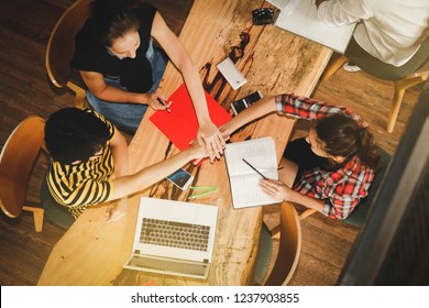 Group work Concepts : Top view Multicultural students, hands-on relationships, good friends, and unity among the co-workers.
