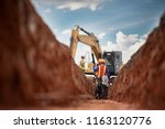 Group of worker and construction engineer wear safety uniform excavation water drainage at construction site