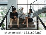 group of worker discussion when break time sitting on the stairs