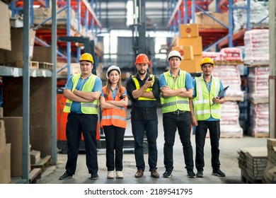 Group worker factory or engineer men and women standing with confidence and success. people working in workplace of warehouse industrial factory. young adult in career of industry of warehouse.