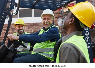 Group Worker As A Logistics Team Has Fun Loading A Delivery