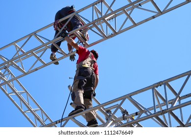  Group of worker in safety uniform working and install reinforced steel column in high column construction site.                              