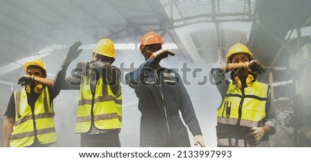 Group workers of men and women covering their noses with their hands for safety, suffocating due to an industrial fire accident. They walked out of the scene consciously before they were harmed.
