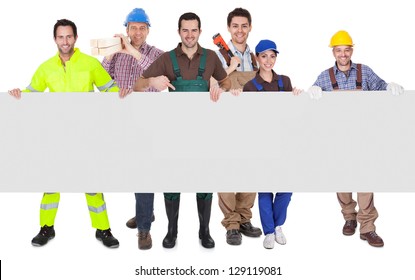 Group of workers presenting empty banner. Isolated on white - Powered by Shutterstock