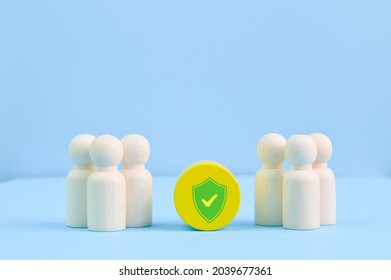 Group of workers and shield. Medical insurance, labor safety and health protection