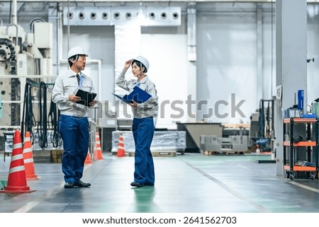 Group of workers working in a factory