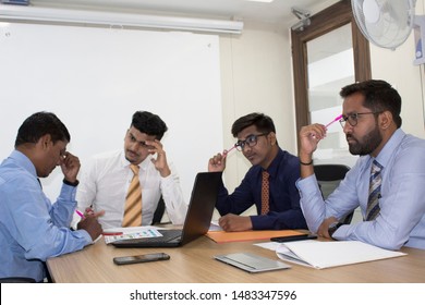 Group Of Worried Business People In Office Boardroom Meeting