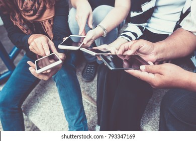 Group Of Yong  People Using Smart Phone For Social Media And Online Shopping Ecommerce Business Concept.technology Communication Network