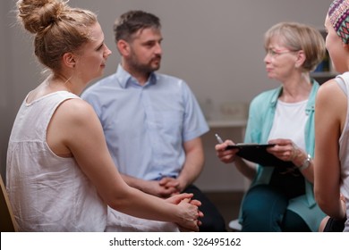 Group of young addicted people during psychotherapy