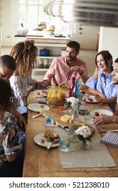 Group Of Young Adult Friends Eating Lunch Together, Vertical